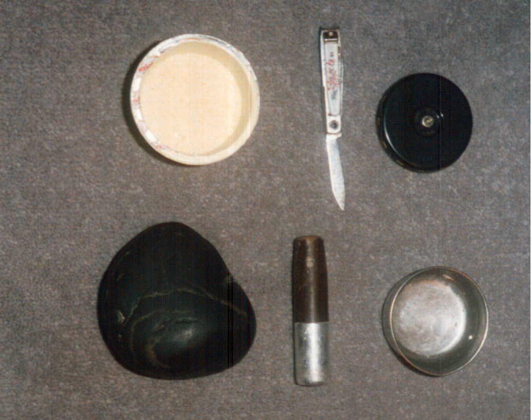 Complete mridangam tuning kit - black stone, wood piece, knife for rava, water cup, and chromatic pitch pipe