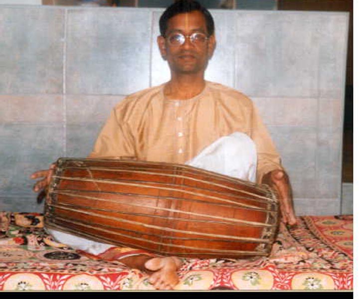 Proper mridangam playing posture - three ring alignment system for correct body position and blood circulation during Carnatic concerts
