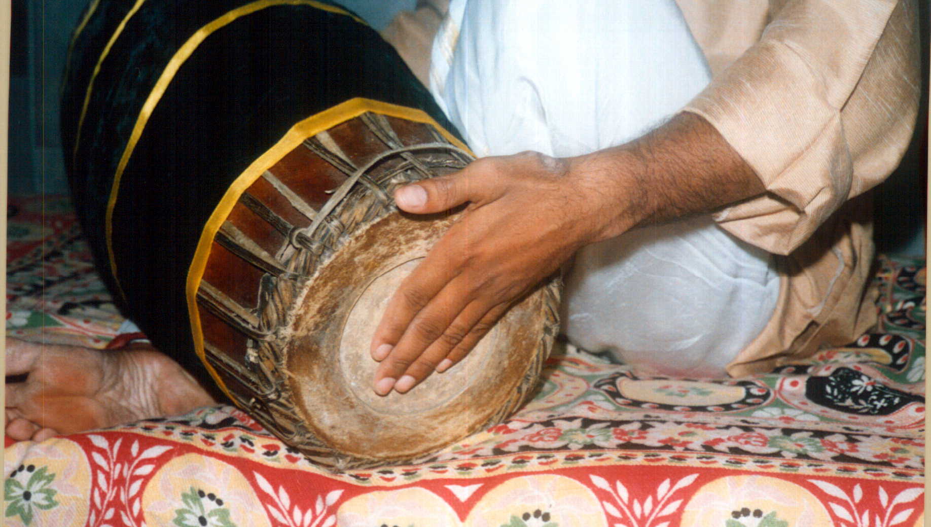 Tha stroke mridangam - left hand position for non-vibrating bass tone in South Indian percussion
